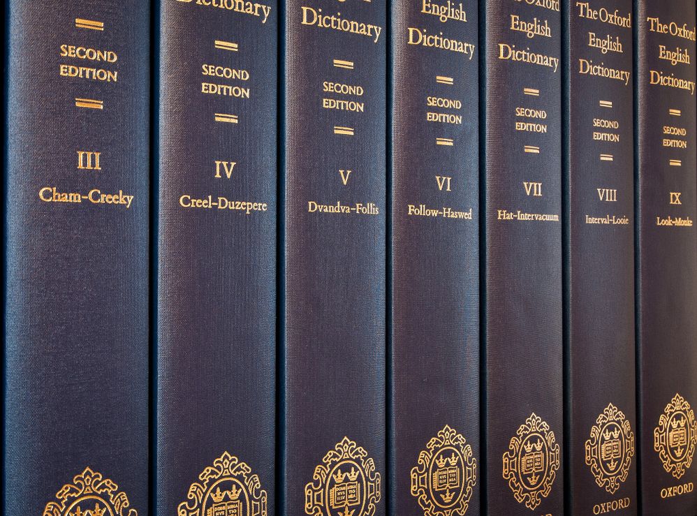 Oxford English Dictionary, printed dictionaries, row of hardcover books